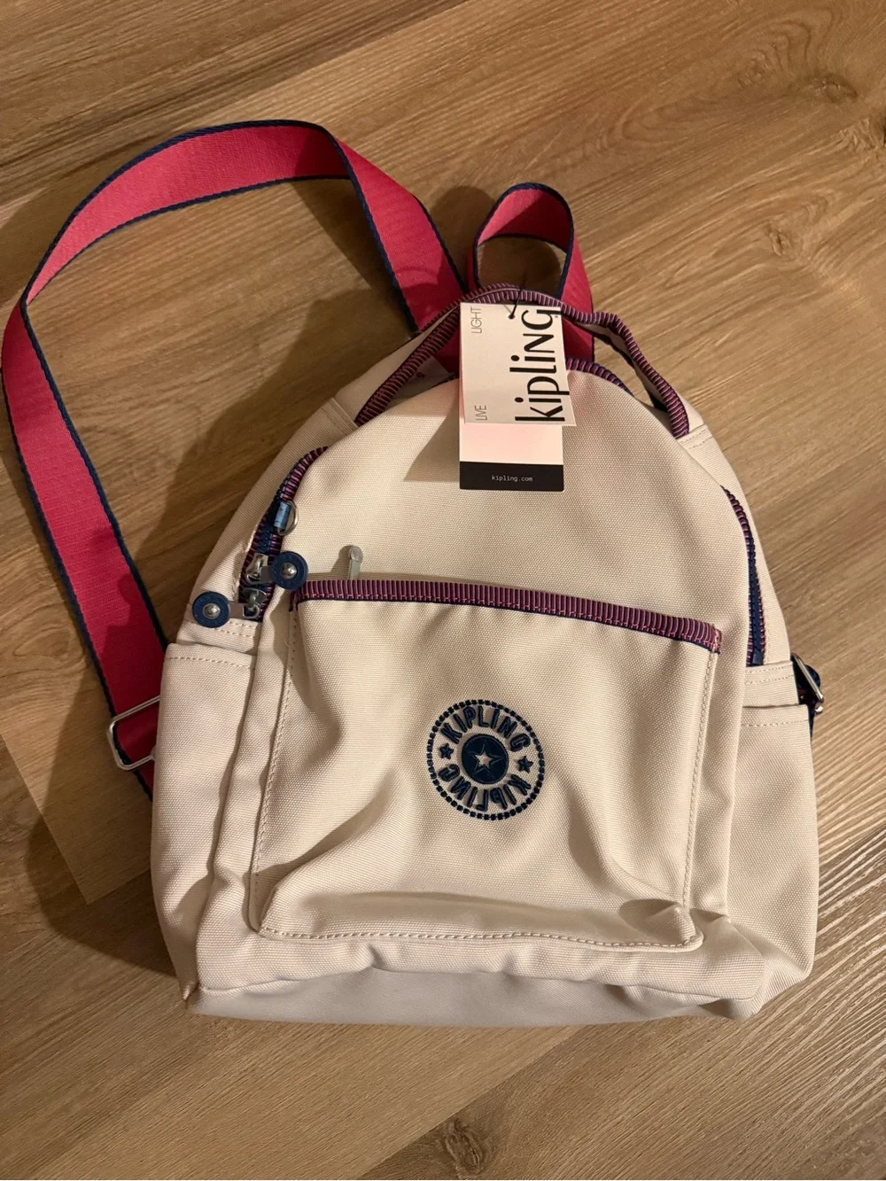 Kipling Cream Kids Backpack with Purple Trim and Blue Charm